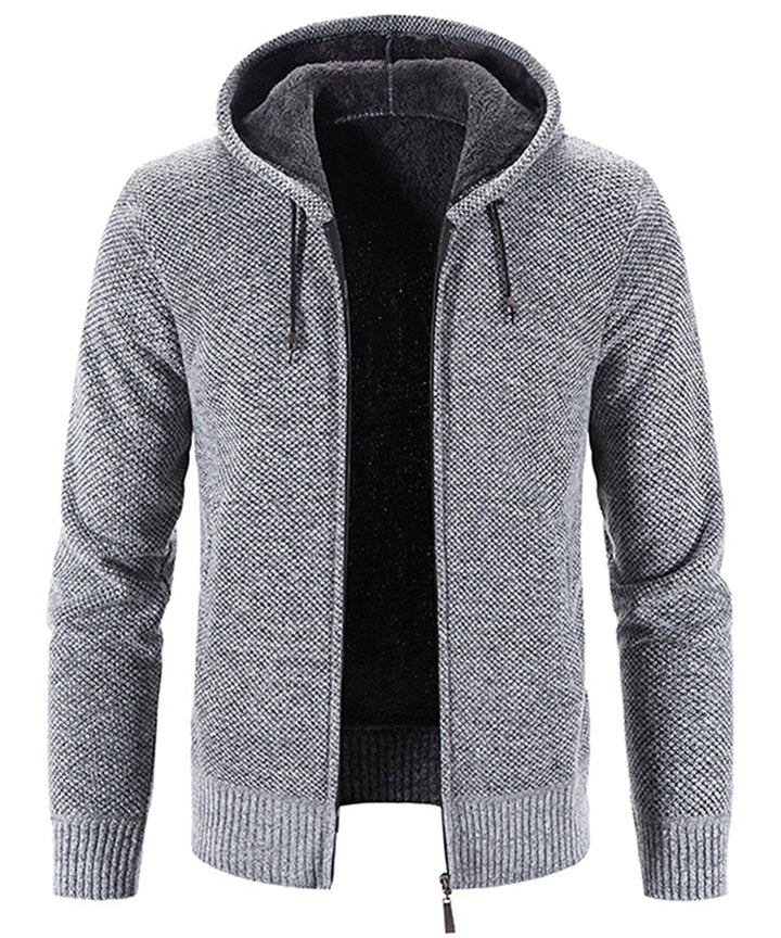 Close-up of a soft, cozy fleece zip-up hoodie featuring a substantial hood & drawstrings