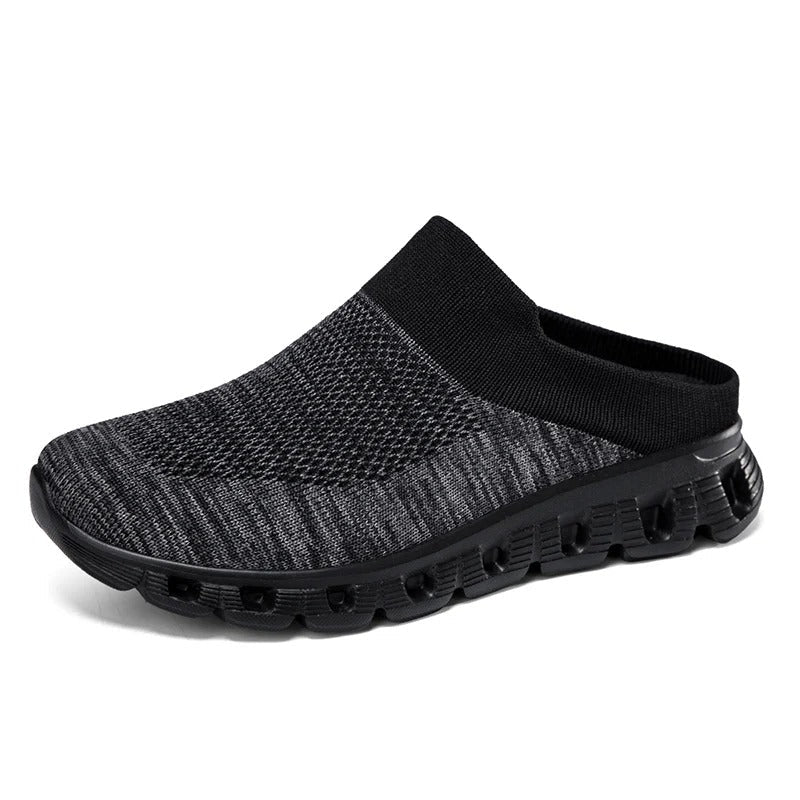 Side view of black unisex cushioned slip-on shoe, backless, for casual easy wear