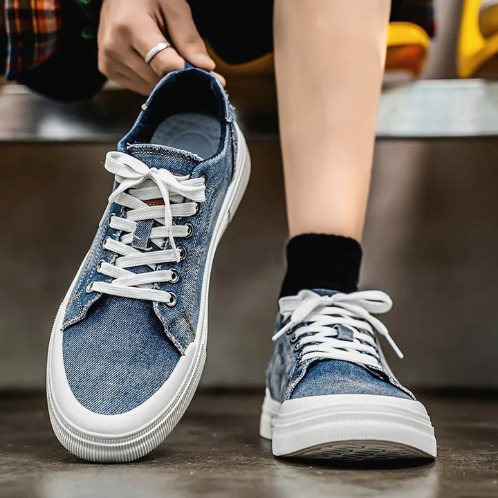 Pair of fashionable unisex denim low-top sneakers, ideal for everyday use and comfortable footwear.