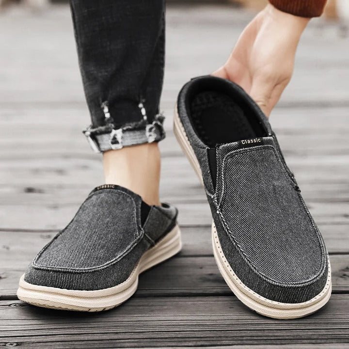 Side view of unisex denim mules, easy-wear, classic casual footwear