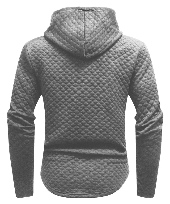Fashion shot of a unisex quilted hoodie paired with jeans, showcasing its versatility. QH001-BLK-M