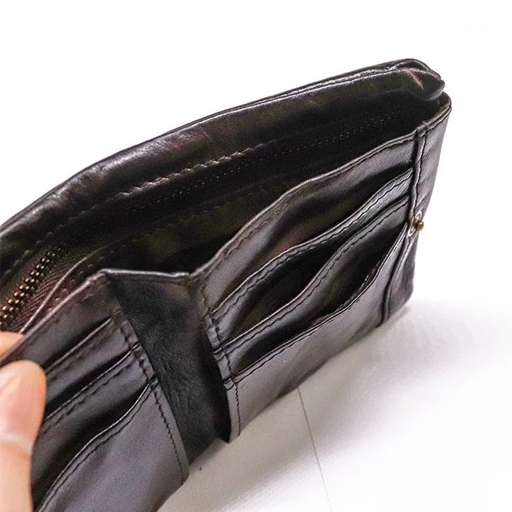 Interior shot of the distressed leather wallet, emphasizing the snap mechanism