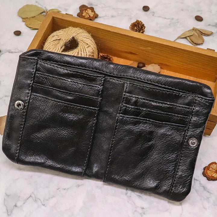 Slim, distressed leather bifold wallet featuring a practical snap fastening