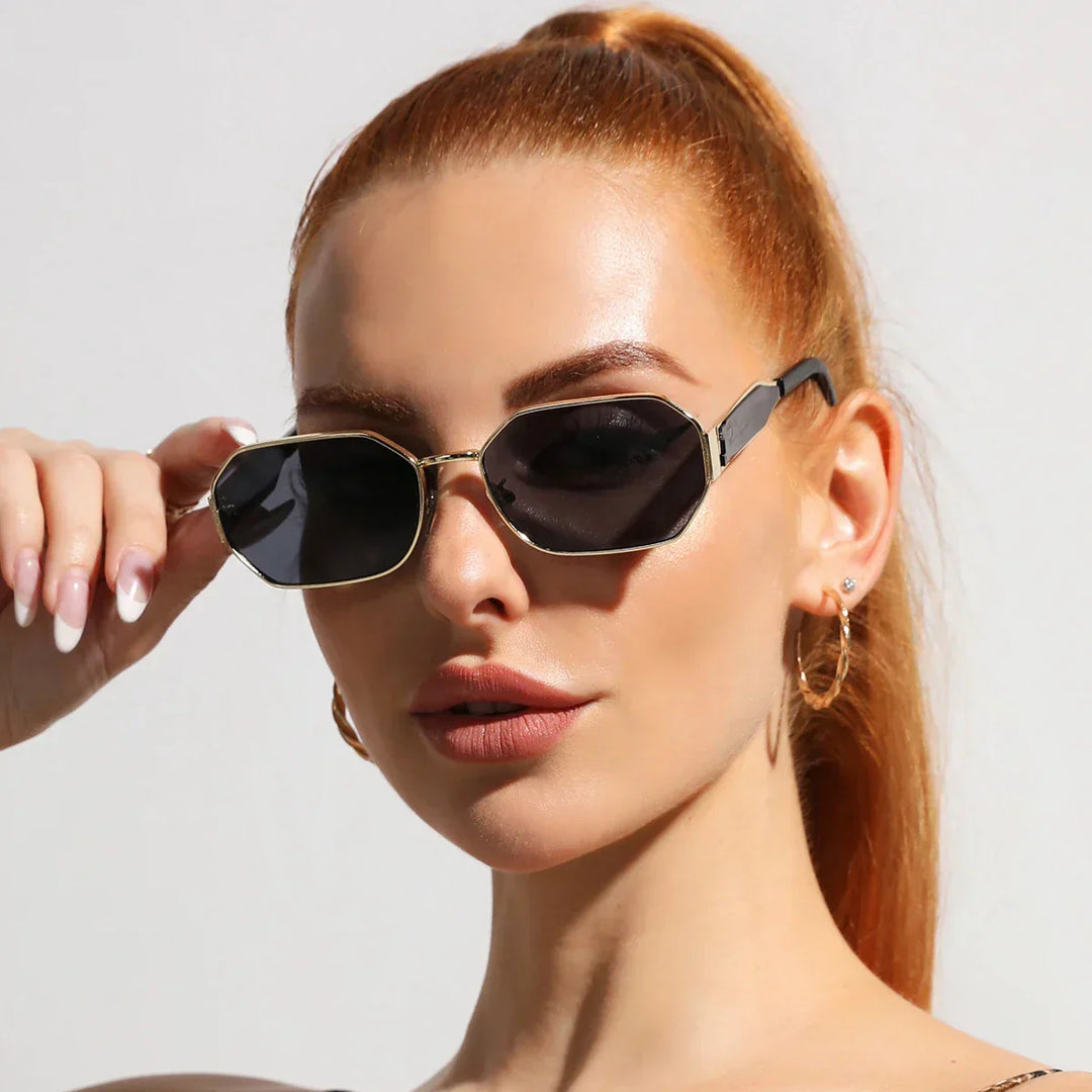Unisex elegant gold frame sunglasses with UV400 protection, reflecting a classic versatile style.