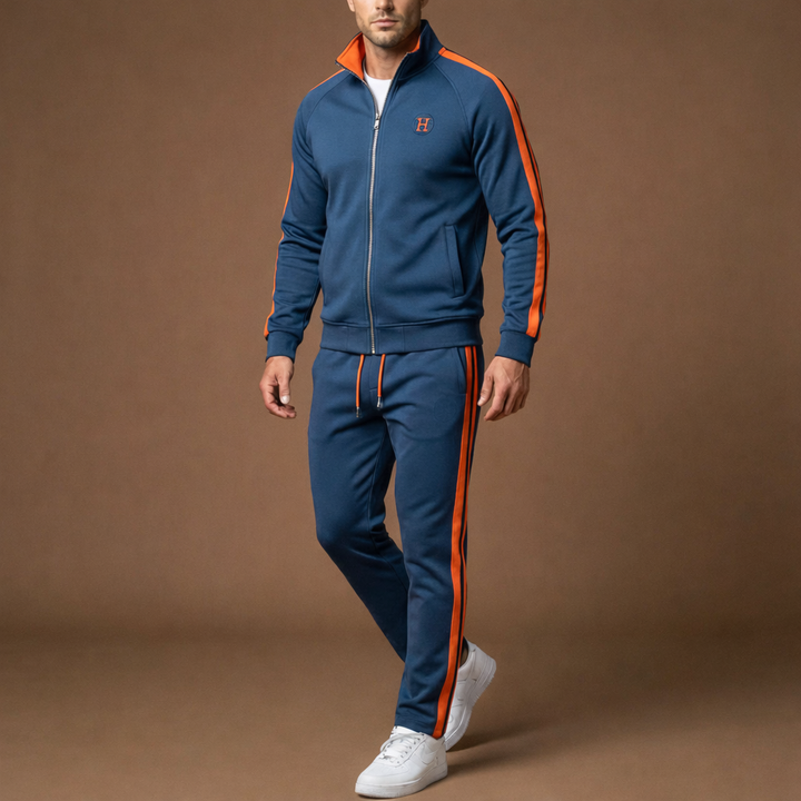 Side view of a model wearing a grey unisex activewear tracksuit, perfect for loungewear