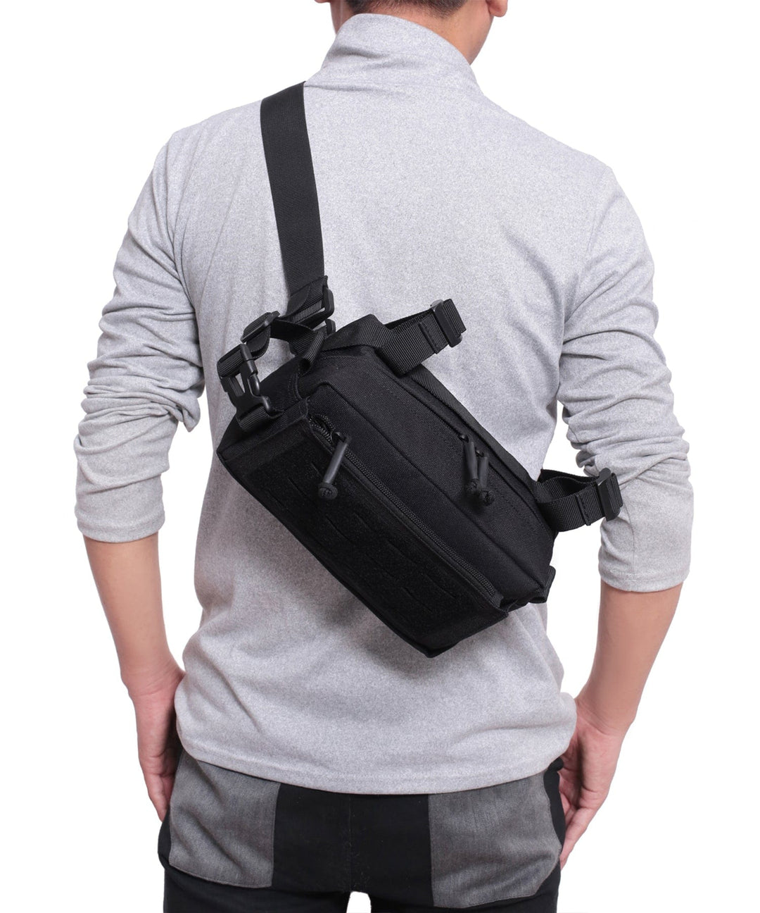 Person reaching into the Everyday Carry Sling Bag, demonstrating ease of access to contents