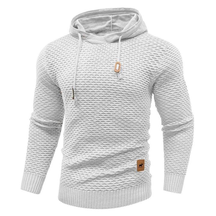 Model posing in a relaxed fit unisex fleece pullover hoodie, everyday comfort