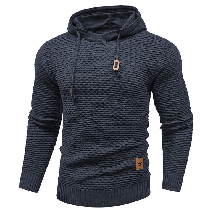 Everyday comfort black fleece hoodie, front pocket detail, side profile, unisex