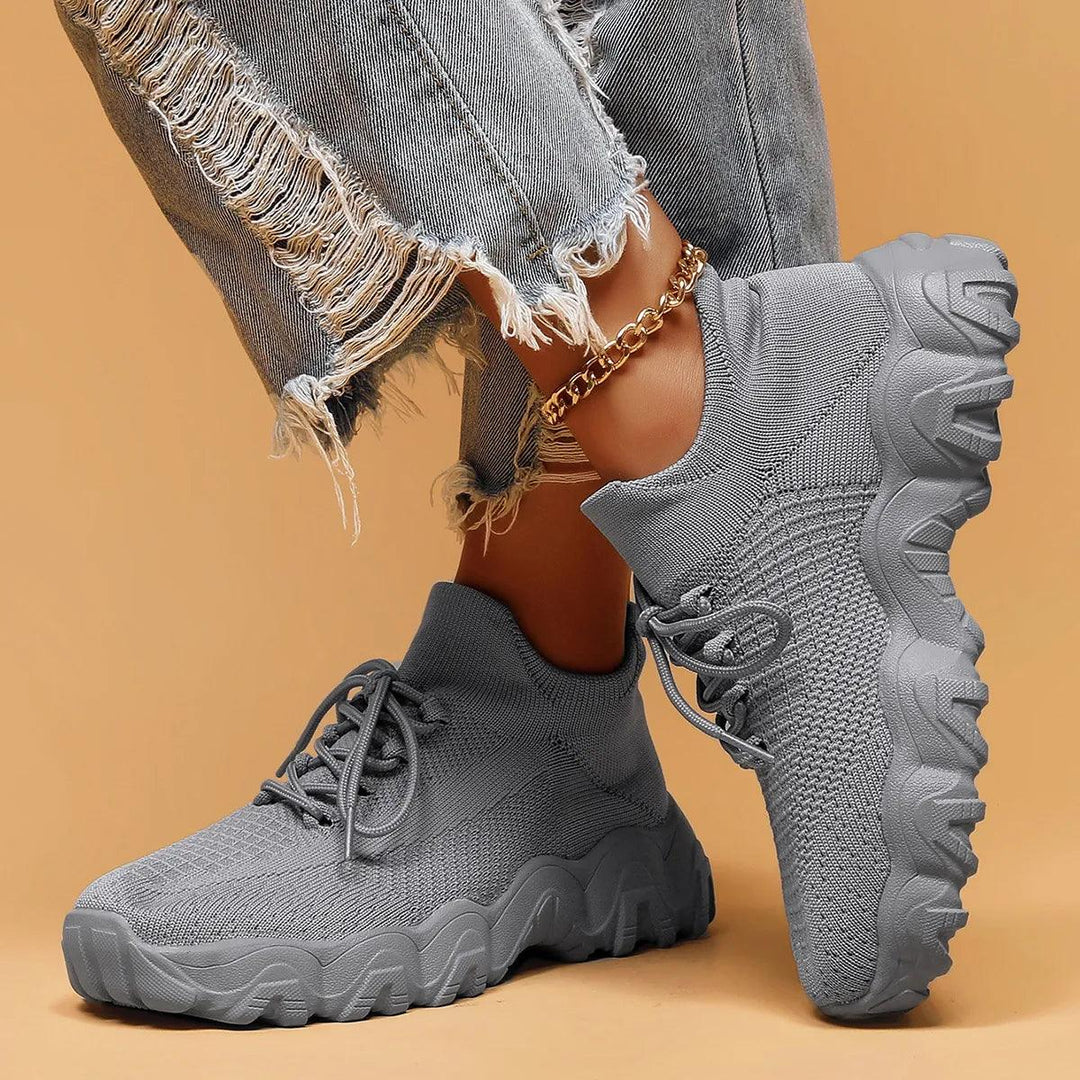 Unisex Everyday Comfort Low-Top Sneakers displayed on a wooden surface, highlighting natural comfort