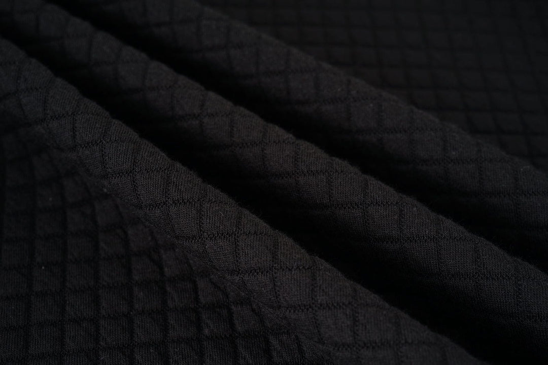 Everyday Warmth Jacket with branding detail, a subtle nod to its quality and unisex appeal.
