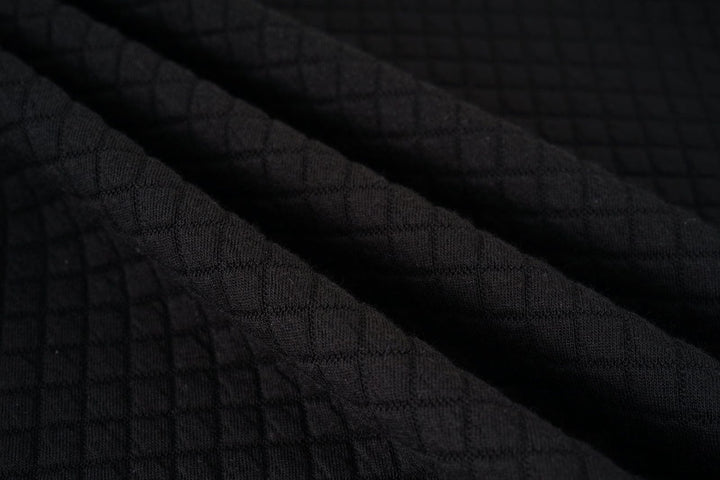 Everyday Warmth Jacket with branding detail, a subtle nod to its quality and unisex appeal.