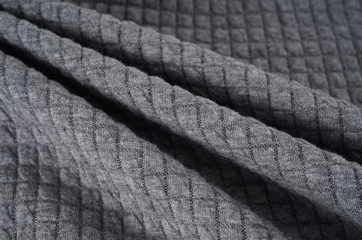 Unisex Lightweight Warmth Jacket on a mannequin, highlighting its structured yet comfortable form.