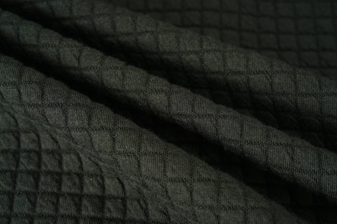 Action shot of someone moving freely in the Unisex Everyday Jacket, showing its flexibility and lightweight feel.