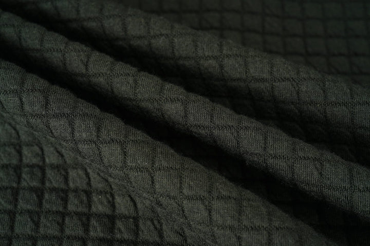 Action shot of someone moving freely in the Unisex Everyday Jacket, showing its flexibility and lightweight feel.