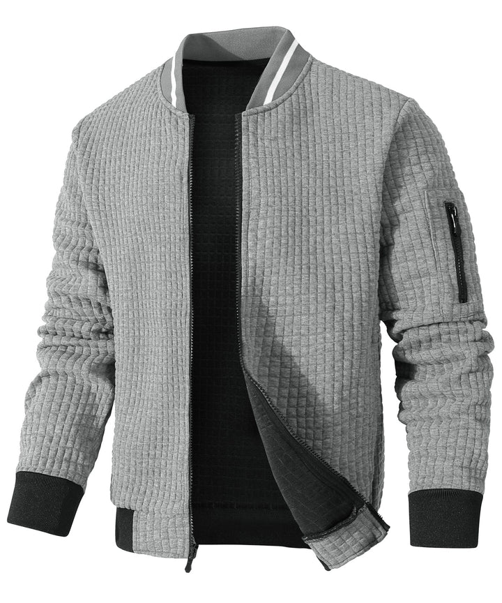 Unisex Jacket in a neutral color, suitable for various outfits and providing lightweight warmth.