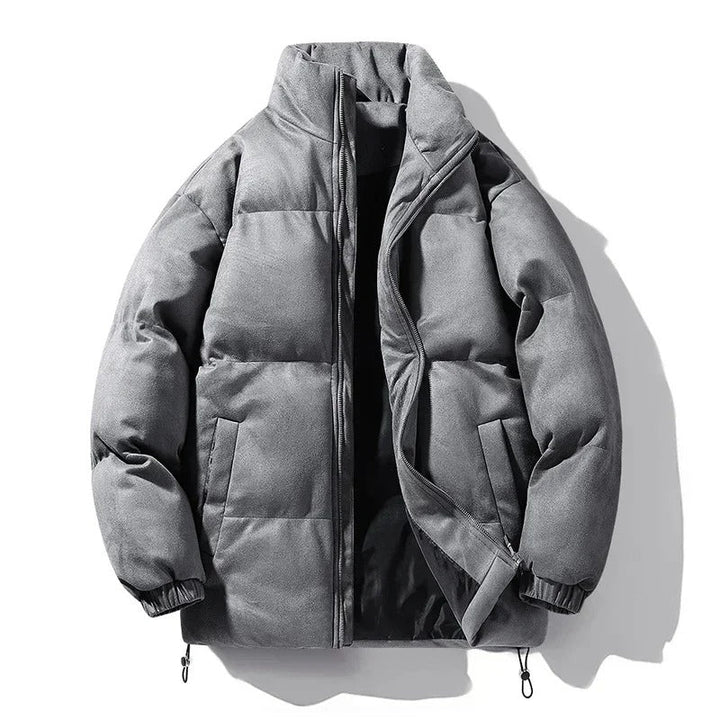 Everyday puffer jacket in a neutral color, unisex, showcasing its lightweight and warm features