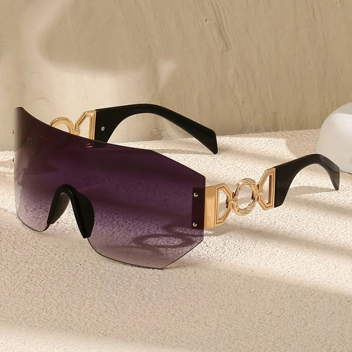 Close-up of frameless unisex gradient sunglasses, showcasing the luminous modern design and sleek temples