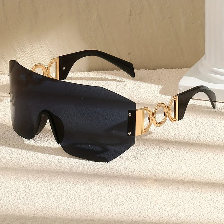Pair of unisex frameless shades with glowing green lenses, offering UV400 protection and a modern aesthetic