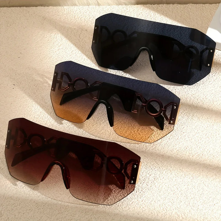 Detailed shot of the frameless construction and luminous lens of these unisex futuristic sunglasses