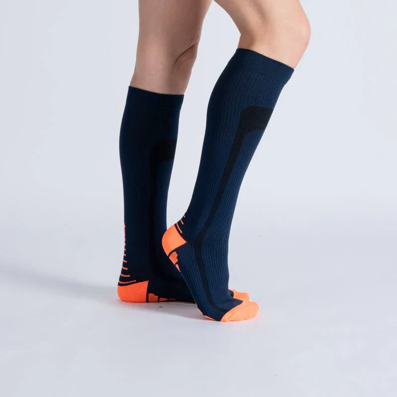 Close-up of blue and orange unisex compression socks, ideal for circulation and gentle support