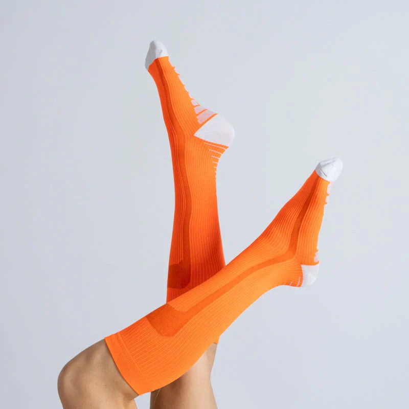Soft knit orange-vanilla unisex compression socks providing gentle support and improved circulation