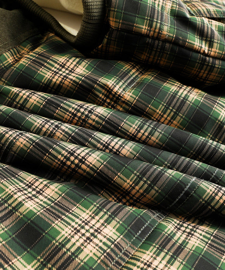 Side view of a green insulated vest, perfect for unisex outdoor apparel