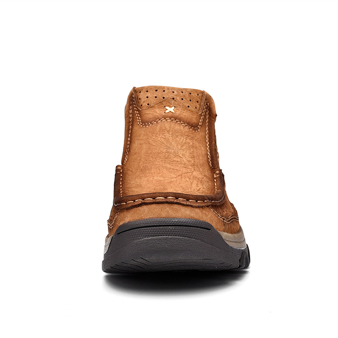 Detail of the slip-resistant sole on black leather high-top orthopedic comfort shoes, unisex