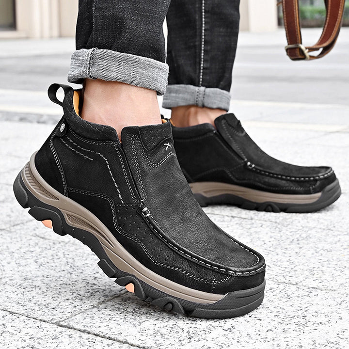 Black leather high-top shoes with a sleek design, unisex and orthopedic for comfort and support