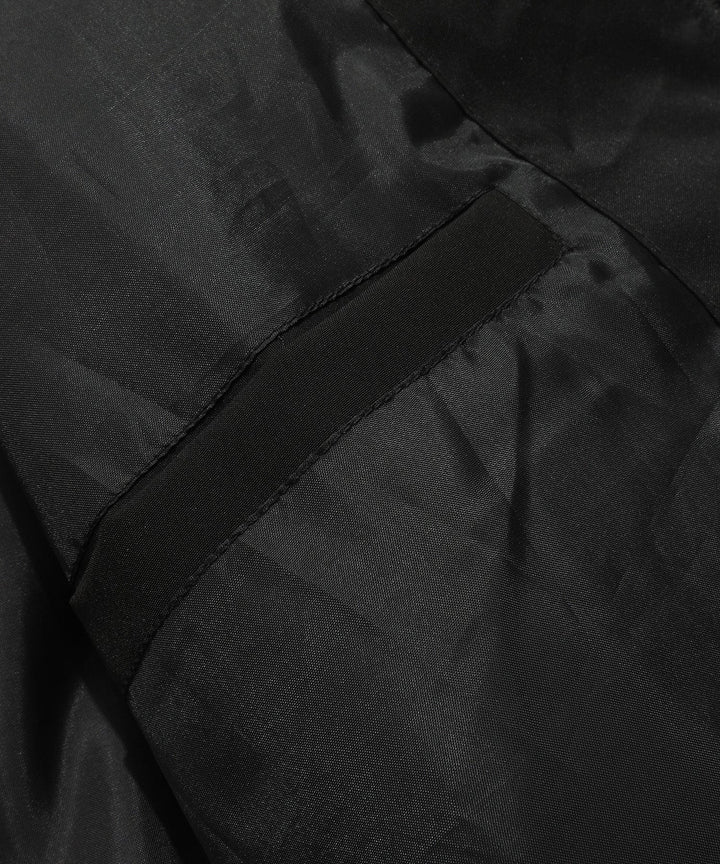 Close-up of the insulated material within a cutaway of the unisex puffer vest, showing warmth technology.