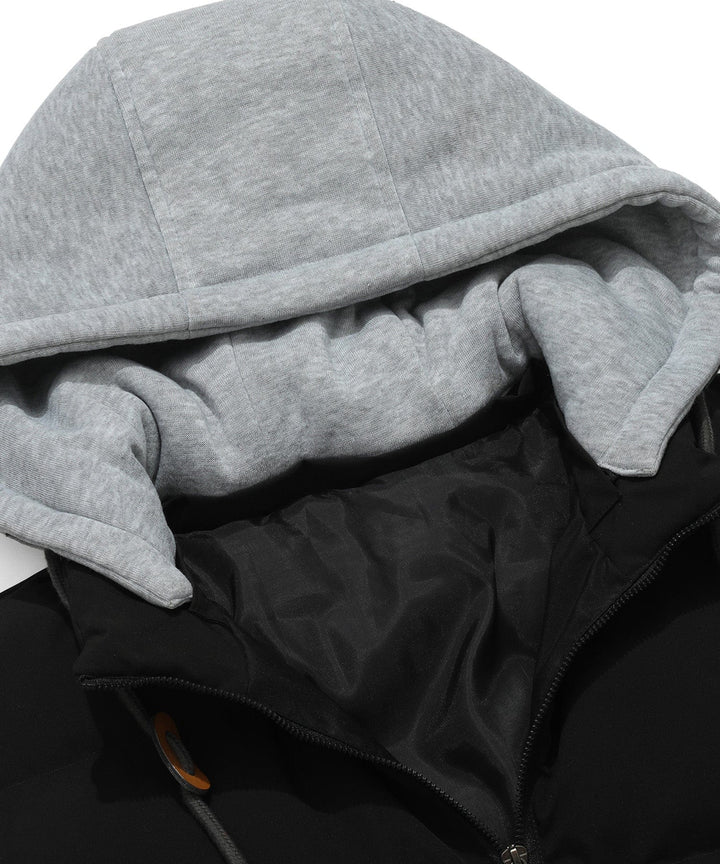 Close-up of the zipper and pockets on a unisex insulated puffer vest with hood, practical and stylish.