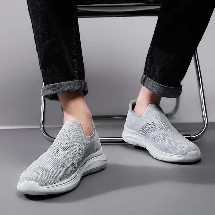 Rear view of a unisex knit casual slip-on sneaker, showing the durable yet lightweight construction.