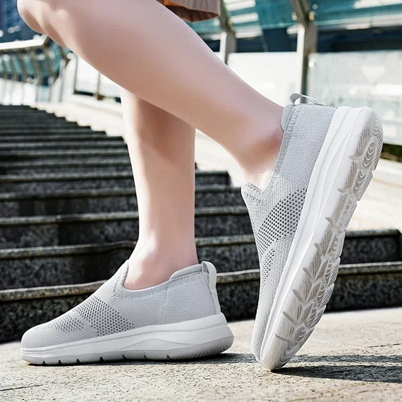 Close-up of the foam sole on a unisex knit slip-on sneaker, detailing its lightweight comfort.
