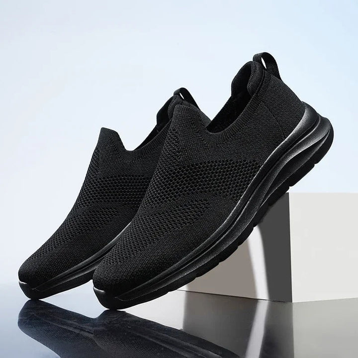 Comfortable unisex knit slip-on shoes in grey, featuring a lightweight and breathable design.