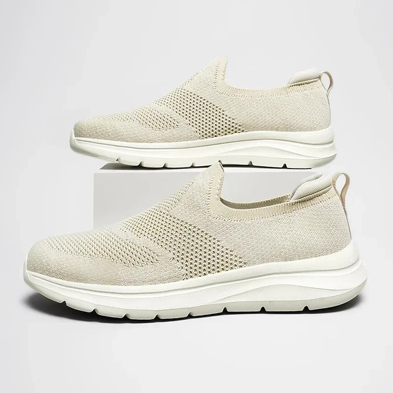 Front view of a unisex knit slip-on sneaker, showcasing its streamlined and casual design.