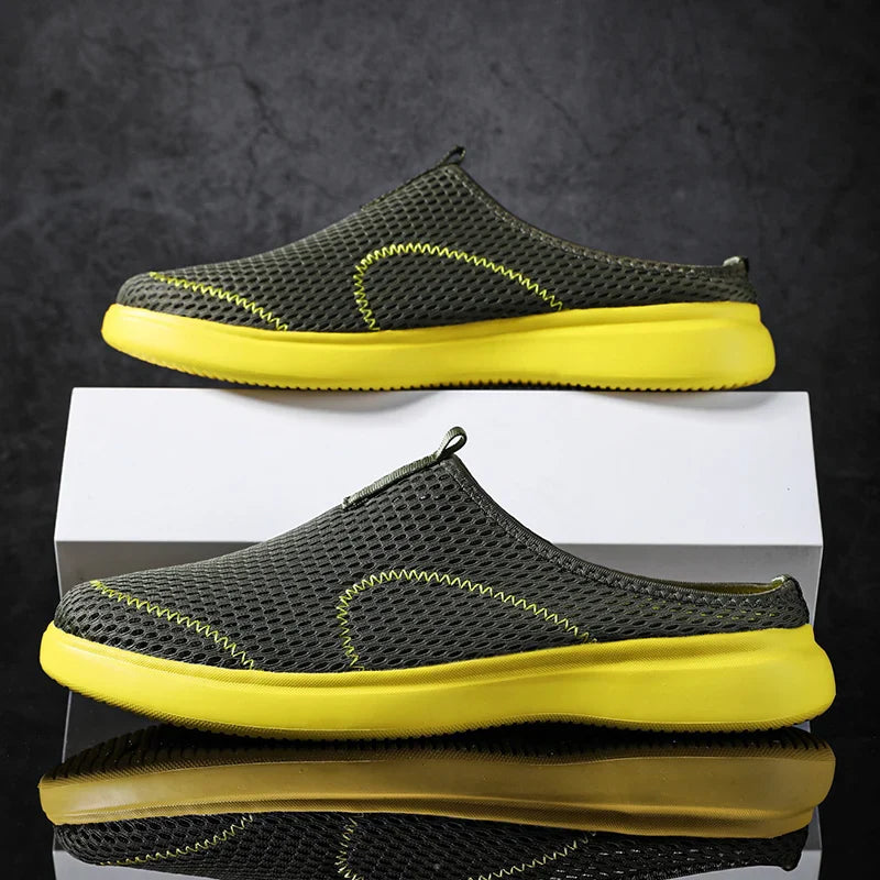 Black slip-on shoes for men and women, featuring lightweight design for everyday comfort.