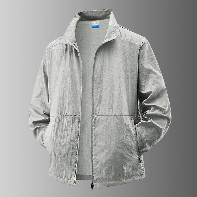 Detail of the zipper and hood on a unisex activewear jacket, offering sun and UV protection