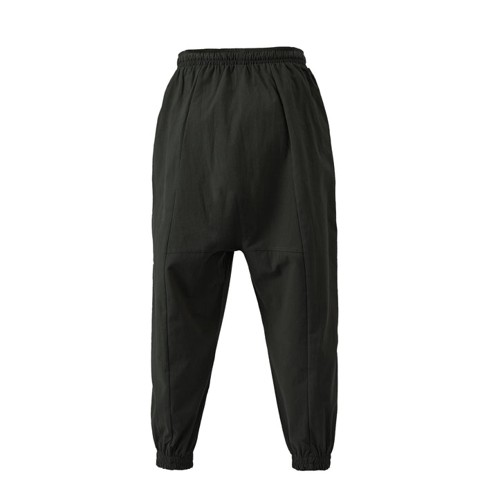Full-length loose fit unisex harem pants, showcasing their comfortable and versatile design for loungewear.