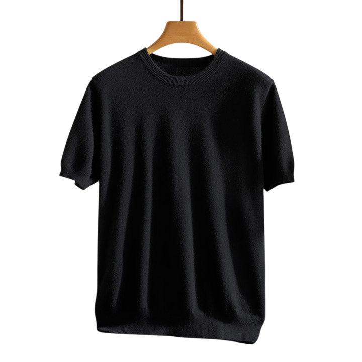 Neatly folded luxury cashmere crewneck tee, emphasizing its premium feel and high-quality material.