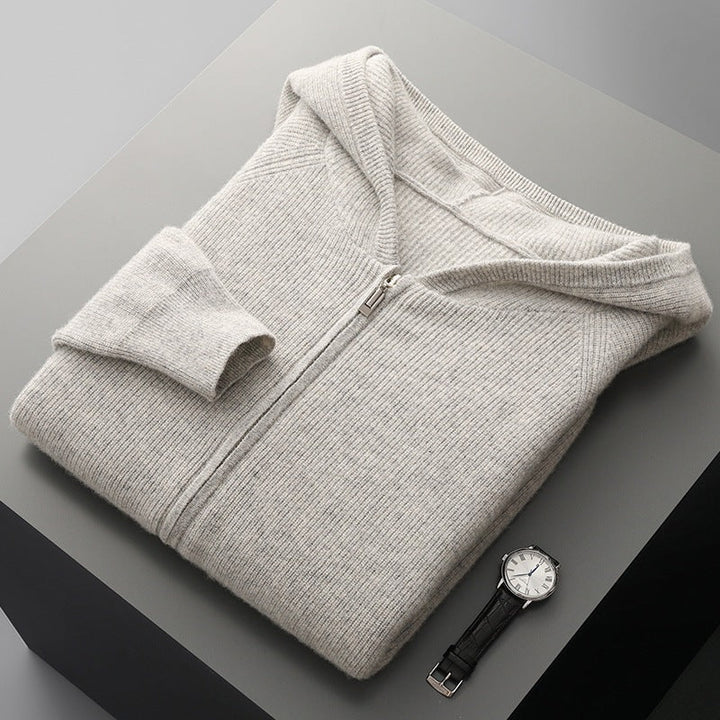 Model wearing a black Unisex Merino Wool Full-Zip Hoodie, demonstrating its versatile casual style.