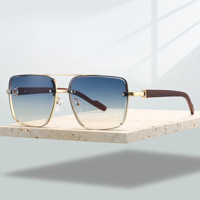 Fashionable unisex aviator eyewear with a sleek gold frame and protective gradient UV400 lenses.