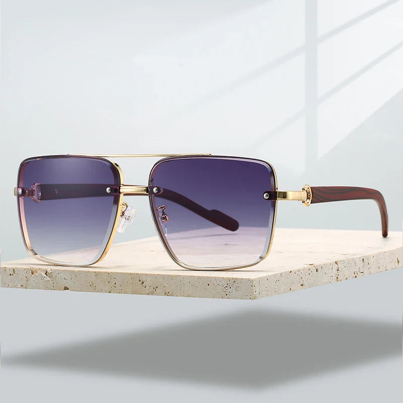 Gold-framed aviator sunglasses, a versatile fashion accessory with UV400 protection and gradient lenses.