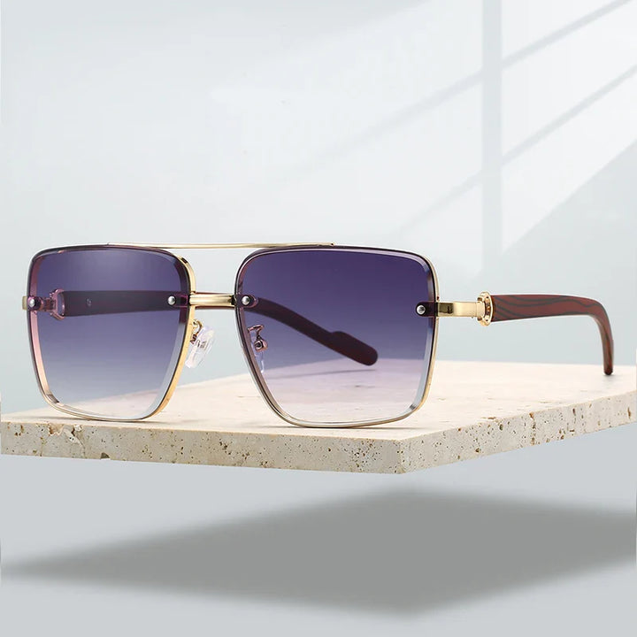Gold-framed aviator sunglasses, a versatile fashion accessory with UV400 protection and gradient lenses.