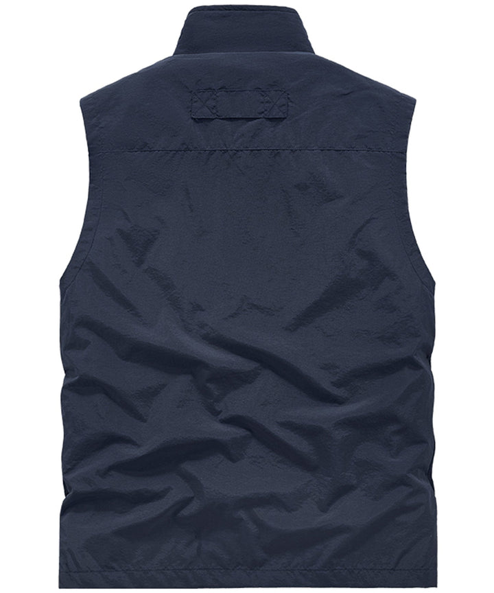 Lightweight unisex multi-pocket vest in a neutral color, excellent for travel and photography.