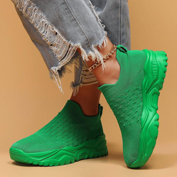 Green orthopedic slip-on shoes for men and women, featuring a lightweight and flexible design for comfort
