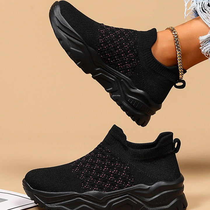 Side view of Ortho Cloud Slip-Ons, black with pink polka dots, designed for comfort and support