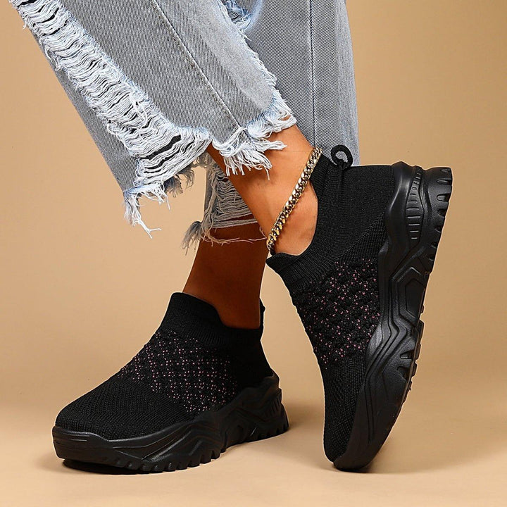 Unisex slip-on footwear: black and pink polka dot Ortho Cloud shoes, known for support