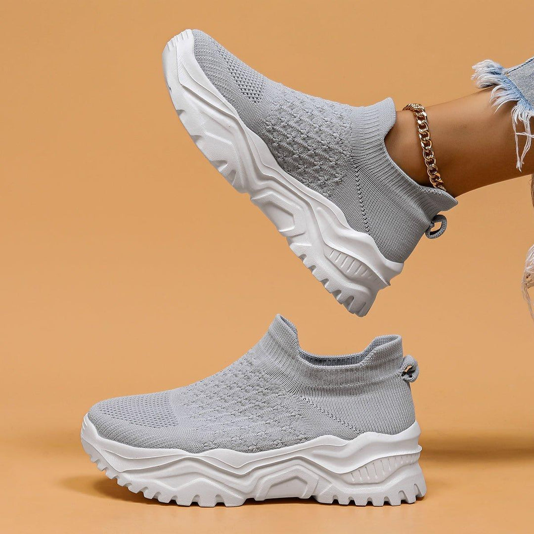 Unisex gray and white slip-on shoes showcasing cushioning and cloud-like comfort for everyday wear