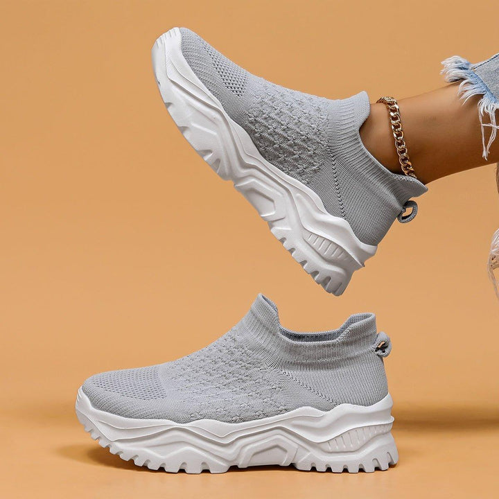 Unisex gray and white slip-on shoes showcasing cushioning and cloud-like comfort for everyday wear