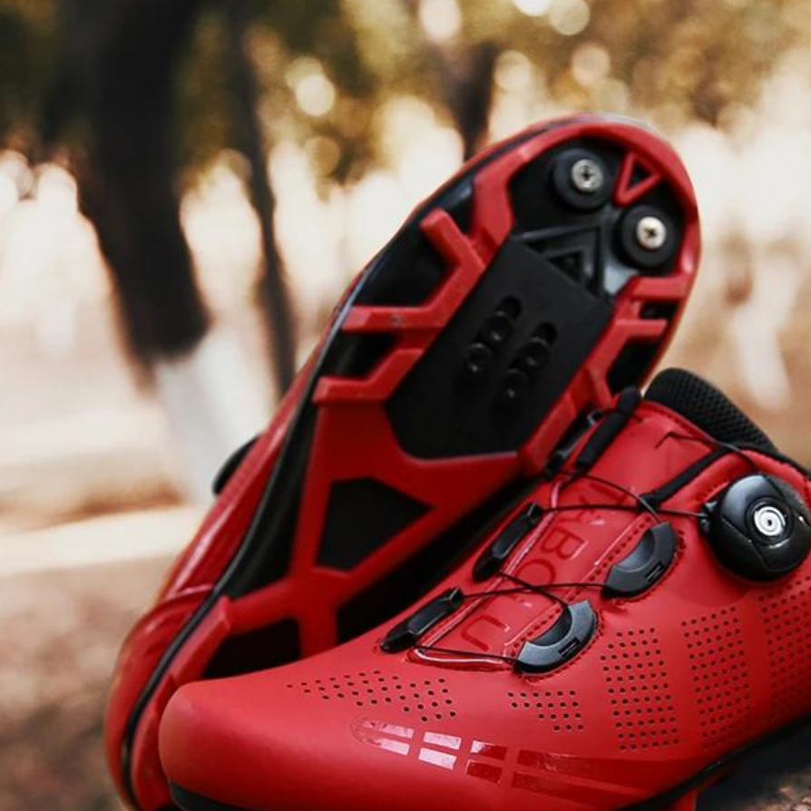 Durable unisex cycling footwear with orthopedic support, enhancing comfort & power for serious road cyclists.