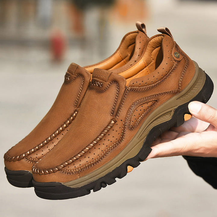 Pair of black Unisex Orthopedic Transition Boots, soft leather, designed for enhanced comfort.
